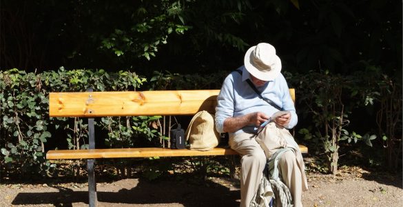 Older guy, sat on a bench